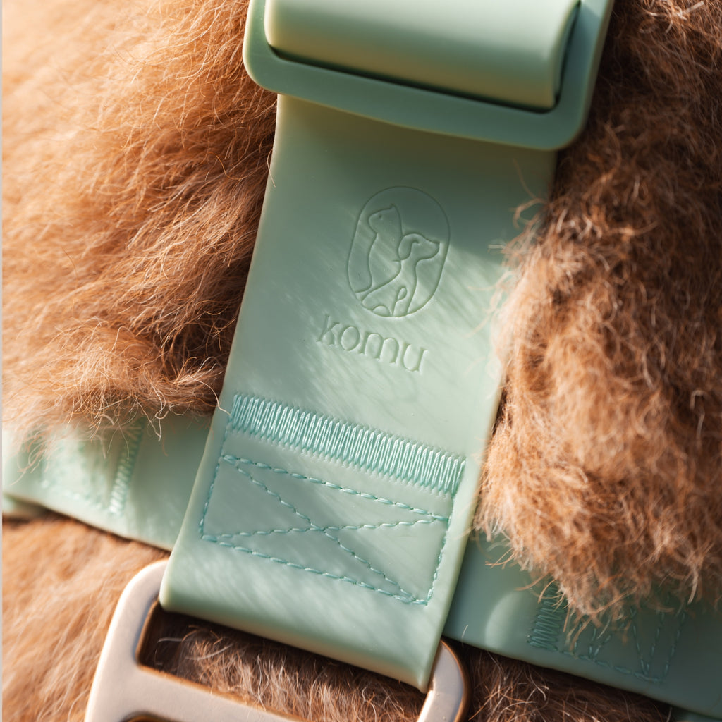 Komu Water-Resistant Harness in Mint with Gold Hardware Closeup Logo