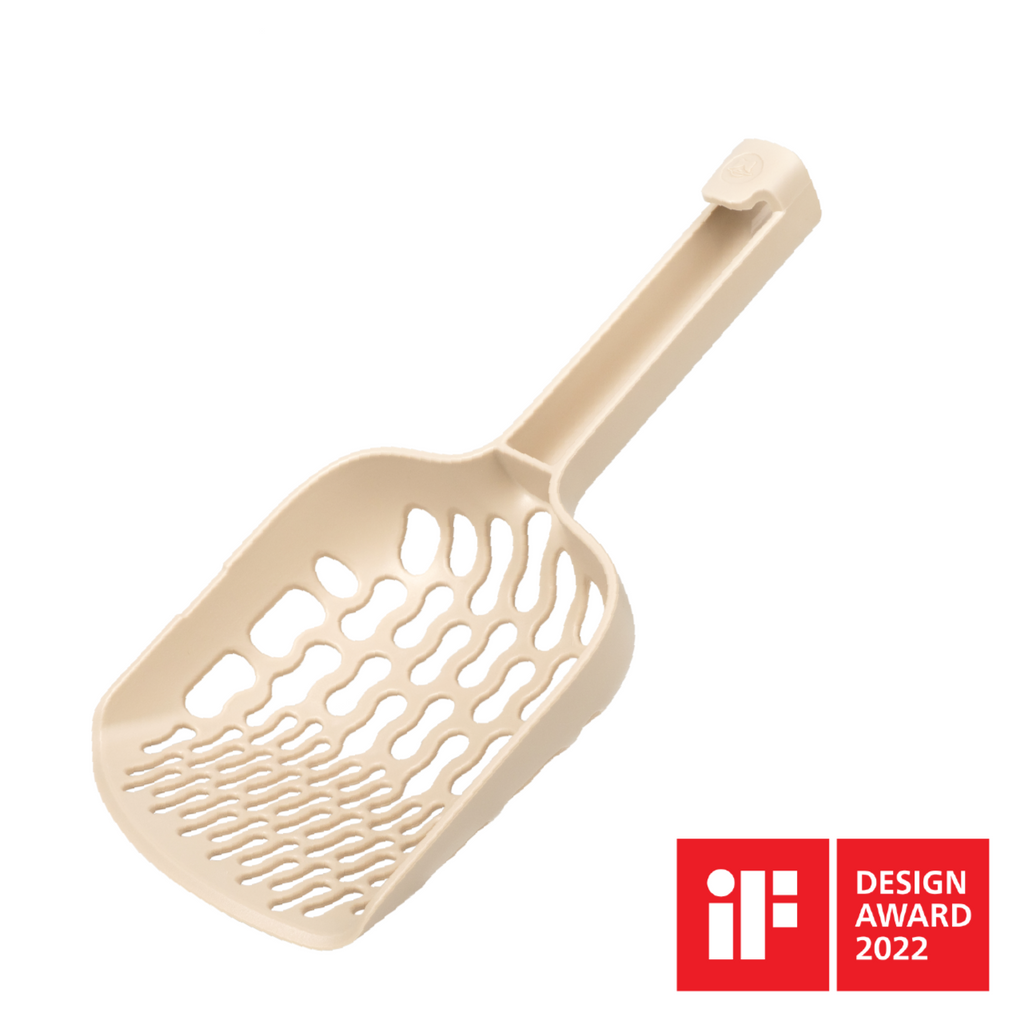 Lady N cat litter scoop product image showing cream-colored ergonomic design with handle and perforated scooping surface, featuring iF Design Award 2022 logo
